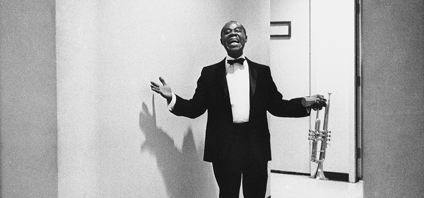 Louis “Satchmo” Armstrong is coming out of a Las Vegas dressing room in September 1970 and announcing to the photographer it was his “debut.” It was the first time back for Satchmo after an illness. (AP Photo/Eddie Adams)