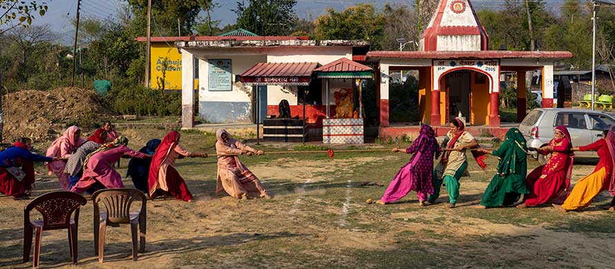 Village women compete in a tug-of-war in the compound of a Hindu temple at Hungloh village, south of Dharmsala, India, Monday, March 14, 2022. (AP Photo/Ashwini Bhatia)