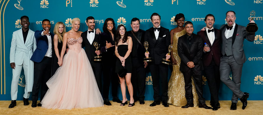 The cast of "Ted Lasso," winner of the Emmy for outstanding comedy series, pose in the press room at the 74th Primetime Emmy Awards on Monday, Sept. 12, 2022, at the Microsoft Theater in Los Angeles. (AP Photo/Jae C. Hong)
