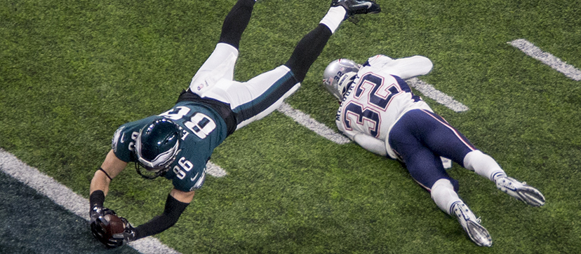 Philadelphia Eagles tight end Zach Ertz (86) dives for a touchdown past New England Patriots safety Devin McCourty (32) in the third quarter of the NFL Super Bowl 52 football game Sunday, Feb. 4, 2018, in Minneapolis. (AP Photo/Bruce Kluckhohn)
